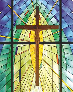 Crucifix in front of stained glass